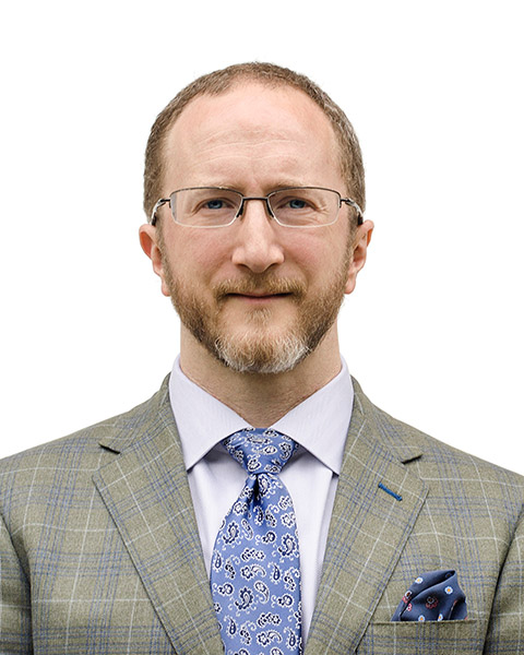 Headshot of Dr. Aaron Boster in a gray suit and blue tie